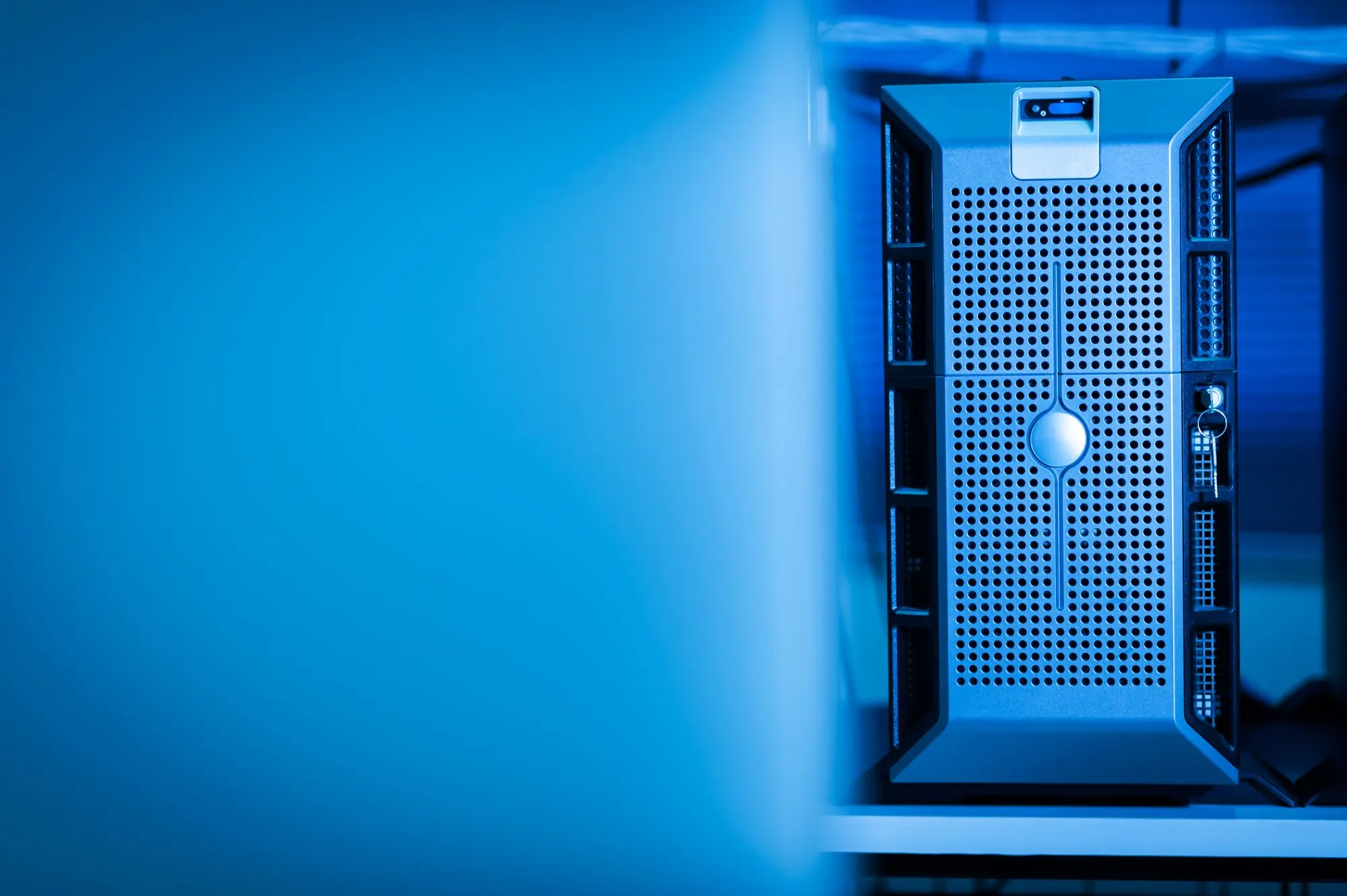 Modern server room network rack with glowing blue illumination
