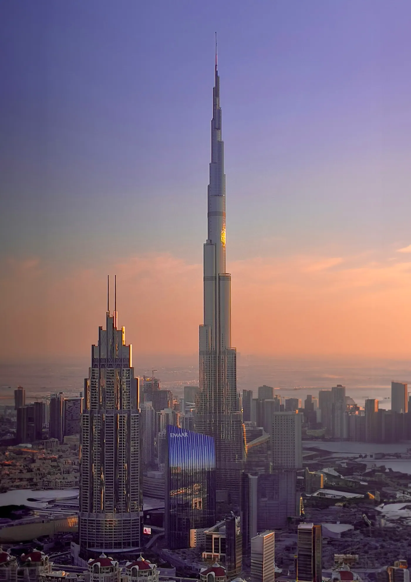 Burj Khalifa towering over the Dubai skyline at sunset